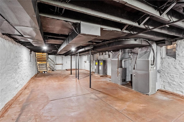 basement featuring heating unit and electric water heater