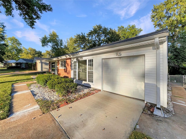 ranch-style house featuring a garage