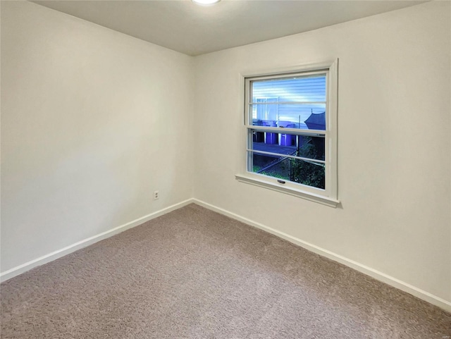 spare room featuring carpet floors