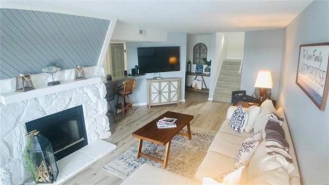 living room with light hardwood / wood-style flooring