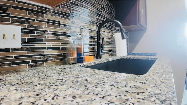 room details with sink and decorative backsplash