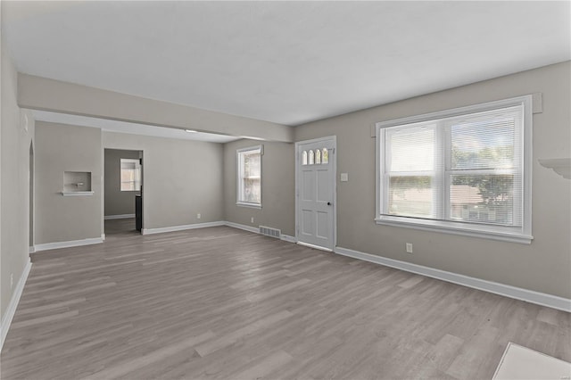 entryway featuring light hardwood / wood-style floors and a wealth of natural light