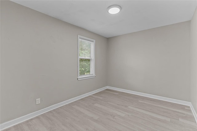 spare room with light wood-type flooring