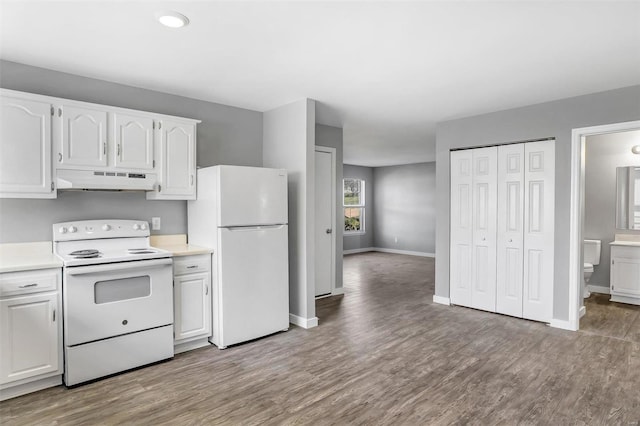 kitchen with white cabinets, white appliances, and light wood-type flooring