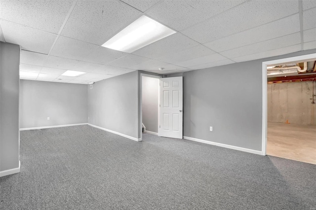 basement with a paneled ceiling