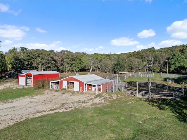 drone / aerial view featuring a forest view