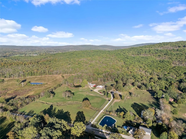 birds eye view of property with a forest view