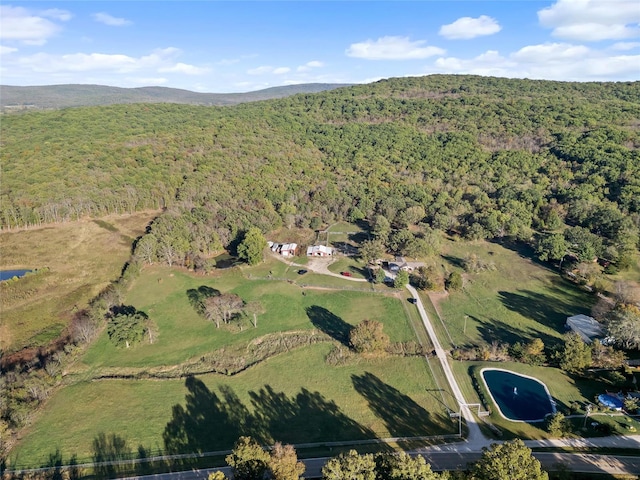 drone / aerial view featuring a view of trees