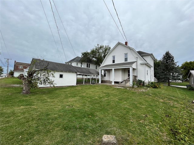 back of property featuring a lawn