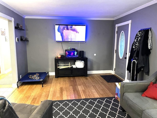 living room with ornamental molding and hardwood / wood-style floors