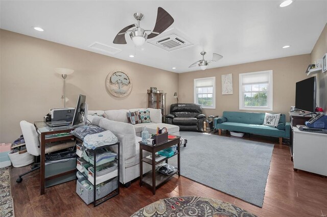 living room with dark hardwood / wood-style floors and ceiling fan