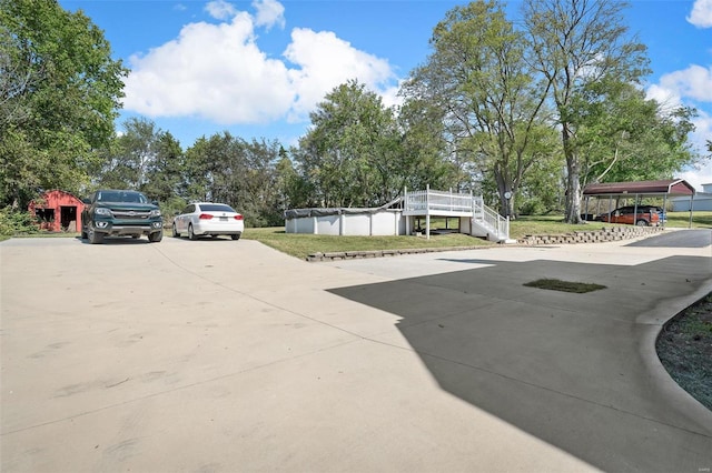 view of parking featuring a carport