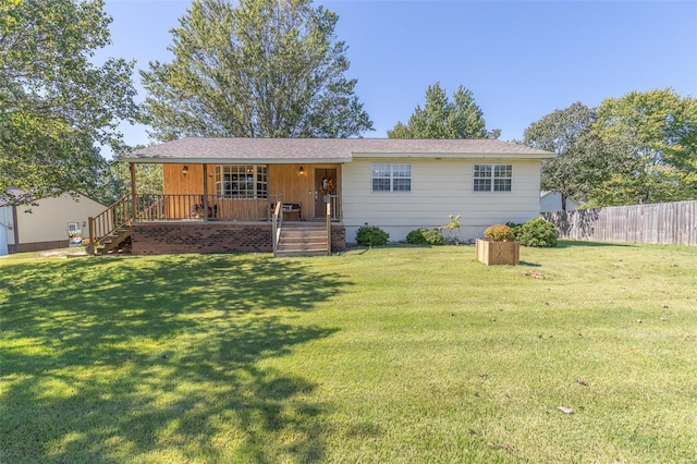 ranch-style house with a front lawn and a porch