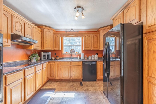 kitchen with a textured ceiling, dark stone counters, sink, and black appliances