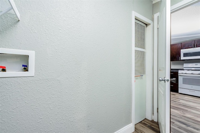 interior space with wood-type flooring and white appliances