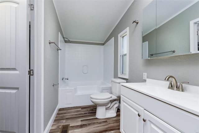 full bathroom with wood-type flooring, shower / bathing tub combination, vanity, and toilet