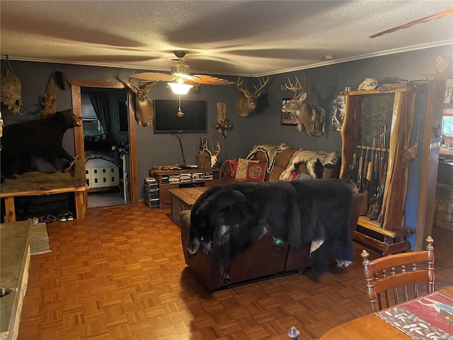 bedroom with ornamental molding, parquet flooring, a textured ceiling, and ceiling fan