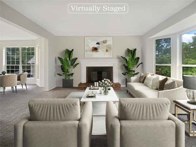 carpeted living room featuring a brick fireplace