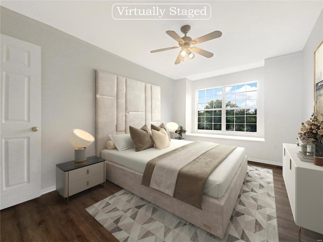 bedroom with ceiling fan and dark hardwood / wood-style floors