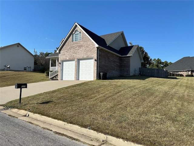 view of home's exterior with a lawn and a garage