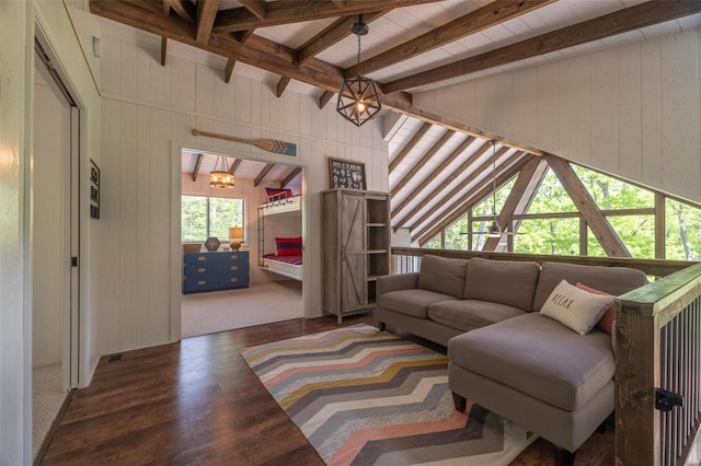 living room featuring vaulted ceiling with beams, wooden walls, dark hardwood / wood-style floors, and a notable chandelier