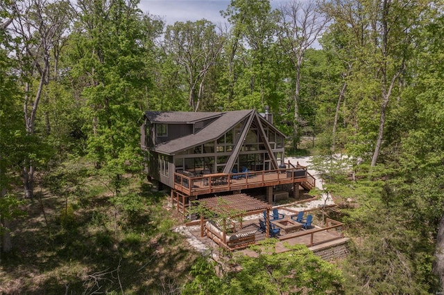 back of property featuring a deck