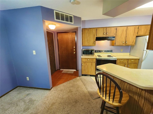 kitchen with carpet and white appliances