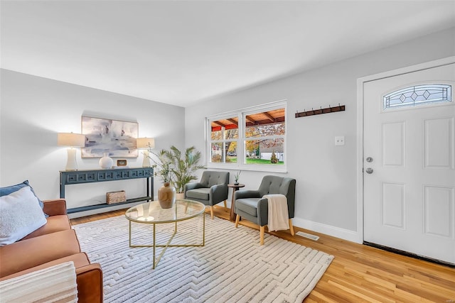 living room with light hardwood / wood-style flooring