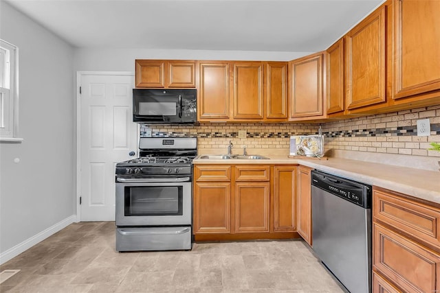 kitchen featuring backsplash, sink, and stainless steel appliances