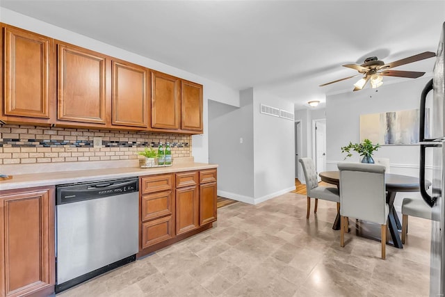 kitchen featuring dishwasher, tasteful backsplash, and ceiling fan