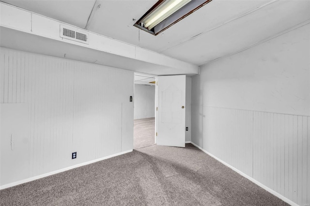 basement featuring carpet flooring