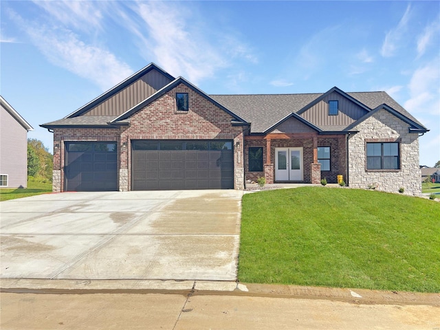 craftsman-style home with a garage and a front lawn