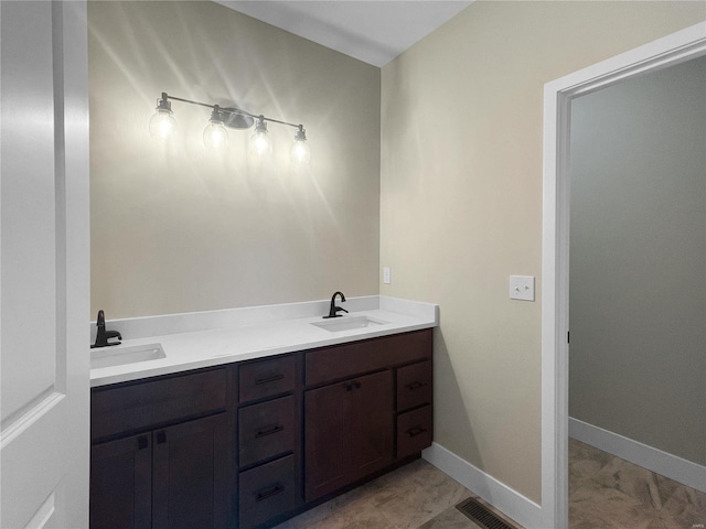 bathroom with tile patterned flooring and vanity