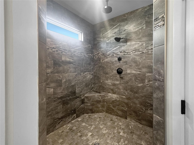 bathroom with tiled shower