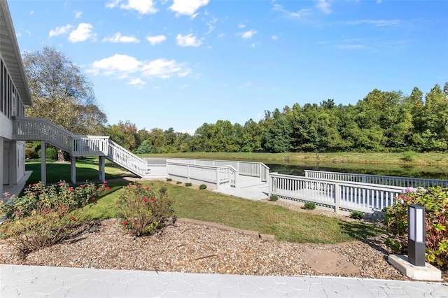 view of yard featuring a deck with water view