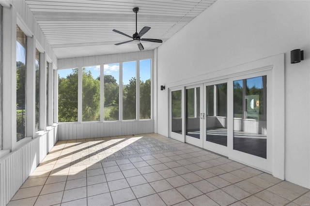 unfurnished sunroom with vaulted ceiling and ceiling fan