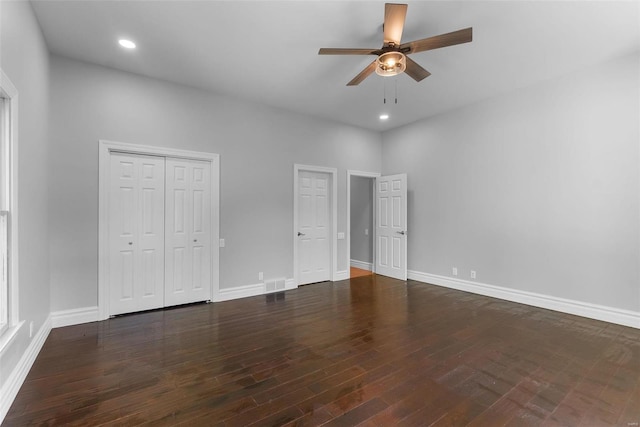 unfurnished bedroom with dark wood-type flooring and ceiling fan