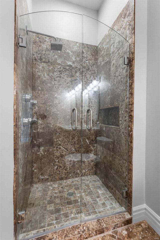 bathroom featuring an enclosed shower