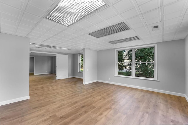 unfurnished room with light hardwood / wood-style floors