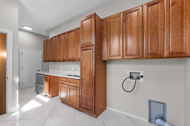 kitchen with light tile patterned flooring