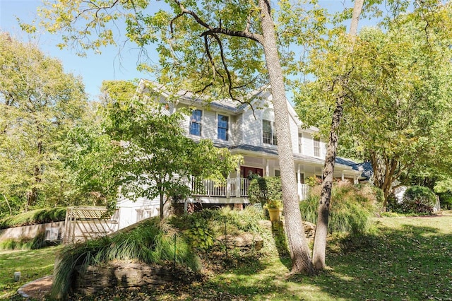 view of side of home featuring a yard