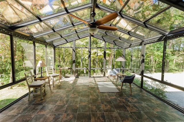 unfurnished sunroom featuring vaulted ceiling and ceiling fan