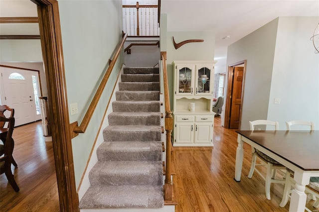 staircase with wood-type flooring