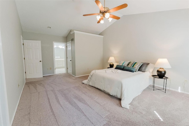 carpeted bedroom with lofted ceiling, ensuite bathroom, and ceiling fan