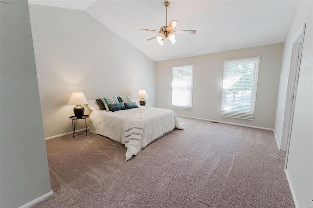 bedroom with light carpet, ceiling fan, and vaulted ceiling