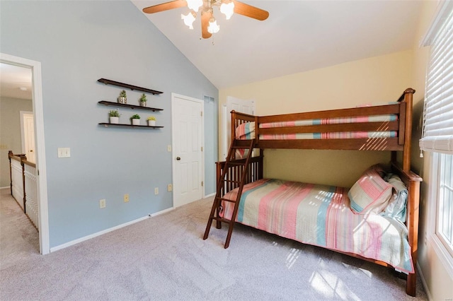 unfurnished bedroom with lofted ceiling, ceiling fan, and light colored carpet