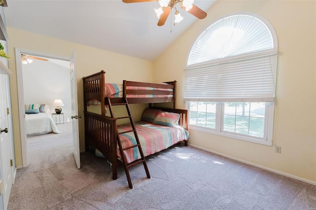 carpeted bedroom featuring lofted ceiling and ceiling fan