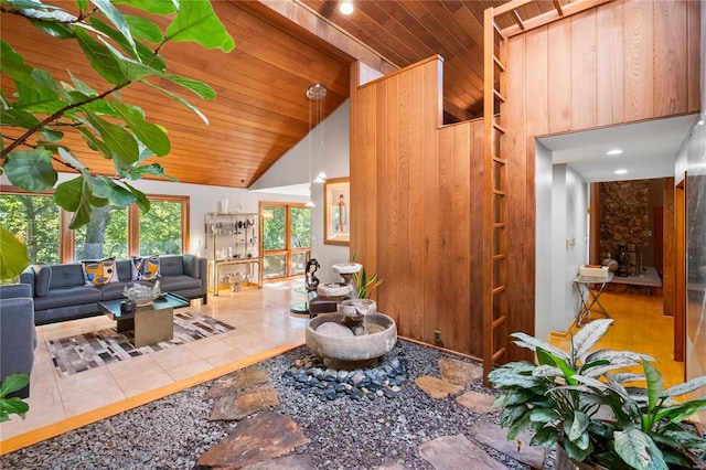 living room with high vaulted ceiling, tile patterned flooring, and wooden ceiling