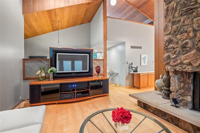 living room featuring wood ceiling, high vaulted ceiling, and hardwood / wood-style flooring