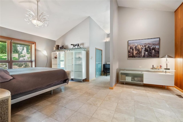 bedroom featuring a notable chandelier and high vaulted ceiling